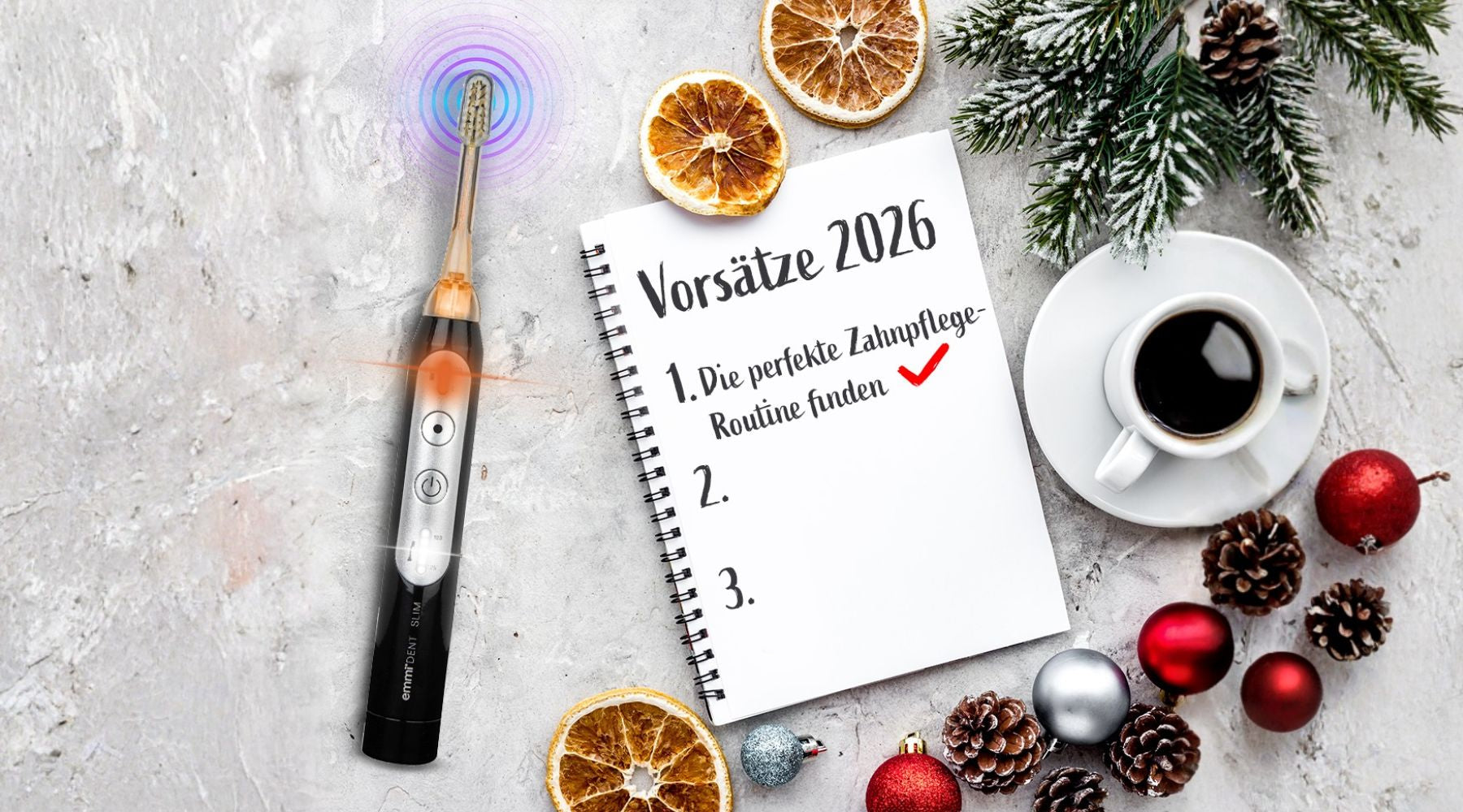 Ultraschallzahnbürste liegt neben Block mit Jahresvorsätzen